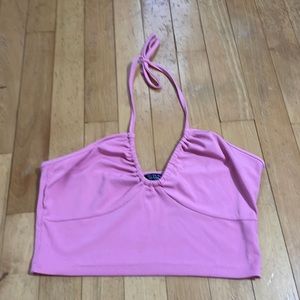 Pink halter top can be worn criss-crossed size: small
